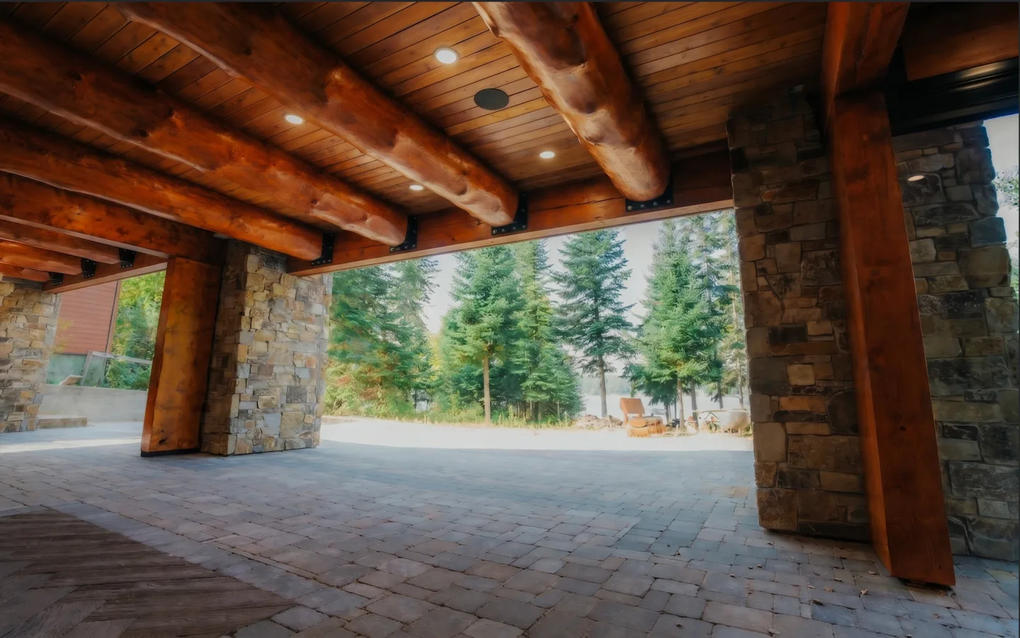 The same covered porch with no glass installed, fully open to the outdoors