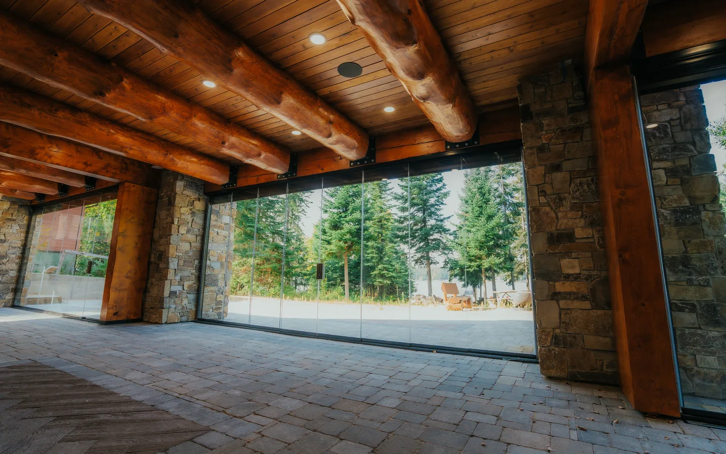 The same porch enclosed with frameless glass panels